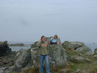 scrambling on the rocks, Guernsey beach