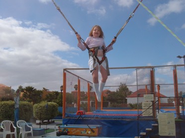 Natalie on a bungy trampoline